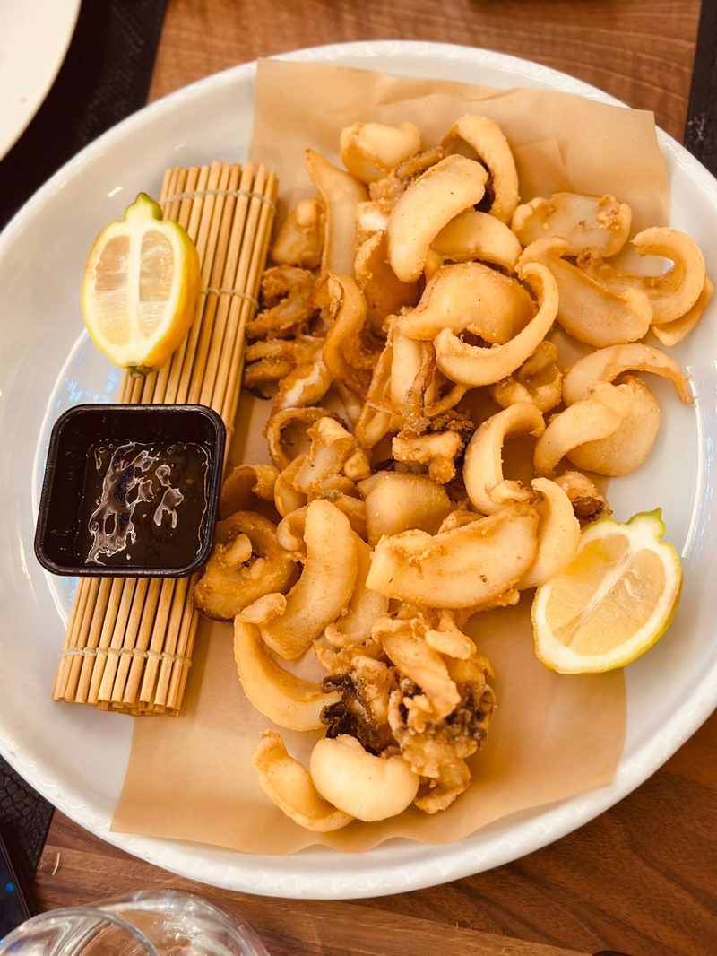 Crispy golden fried calamari served with lemon and dipping sauce